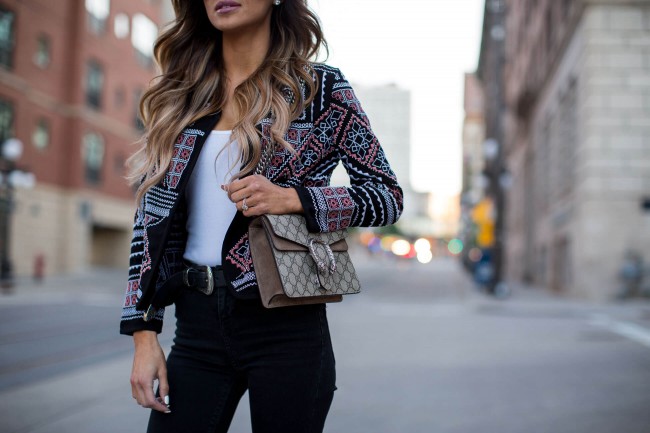 fashion blogger mia mia mine carrying a gucci dionysus bag in minnesota