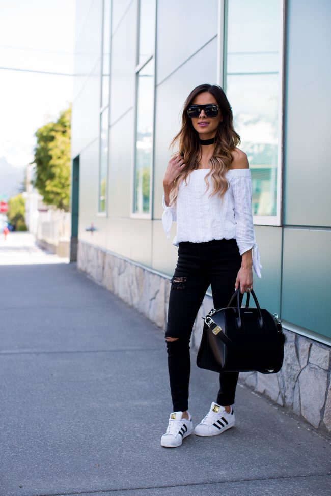 mia mia mine wearing adidas and a givenchy antigona bag