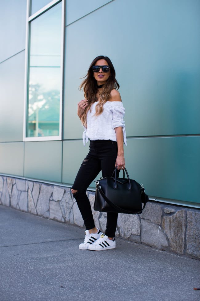 mia mia mine wearing a white off-the-shoulder top by bailey 44 and topshop black jeans