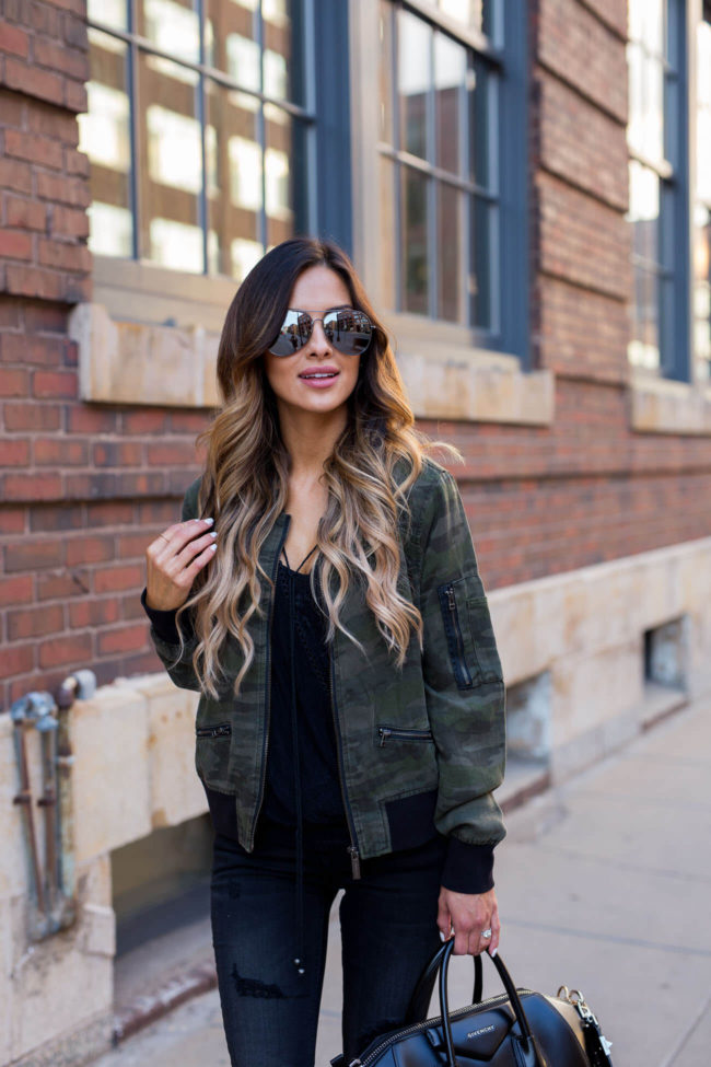 fashion blogger mia mia mine in a sanctuary camouflage jacket and free people lace top