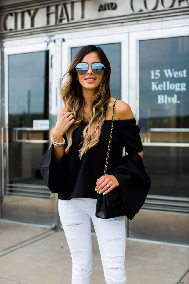 mia mia mine wearing a black off the shoulder top from shopbop