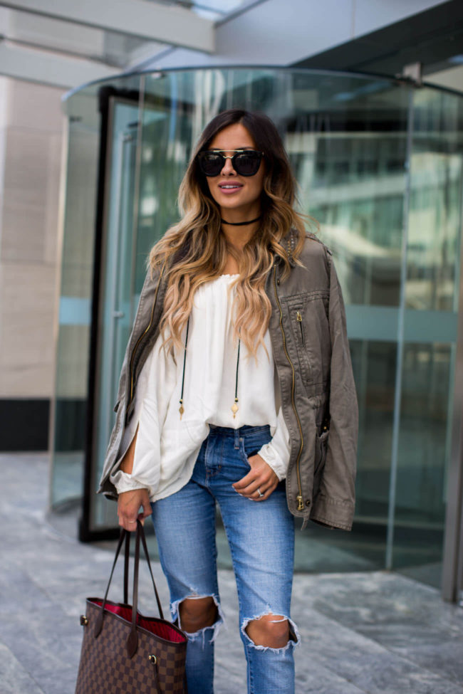 fashion blogger mia mia mine wearing a white slit sleeve top by sanctuary