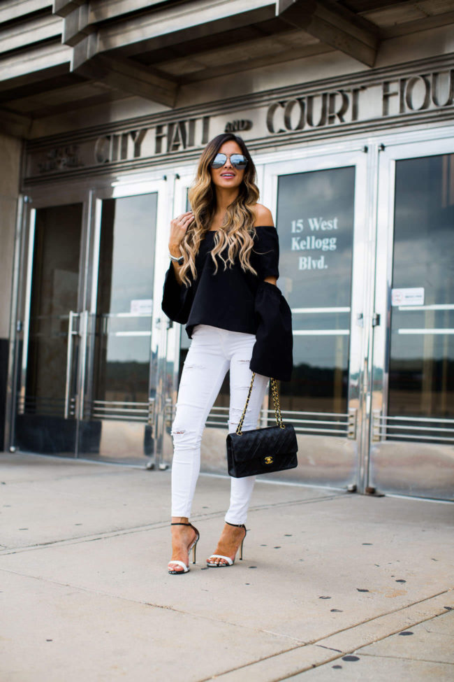 mia mia mine wearing a black cutout top from shopbop and white jeans from topshop