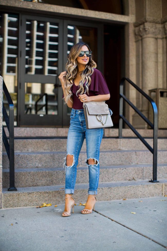 fashion blogger mia mia mine wearing a burgundy bodysuit from nordstrom