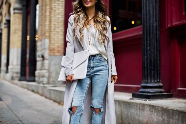 mia mia mine wearing a gray trench coat from missguided