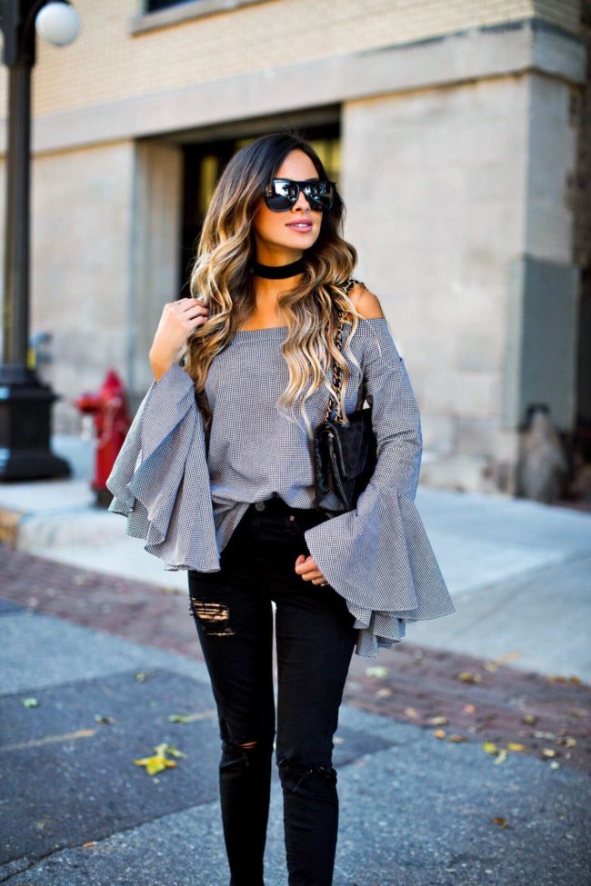 fashion blogger mia mia mine wearing an off-the-shoulder gingham top 