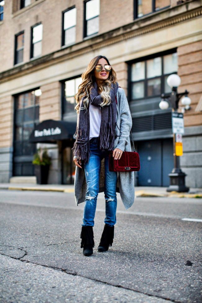 mia mia mine wearing a velvet burgundy handbag by rebecca minkoff