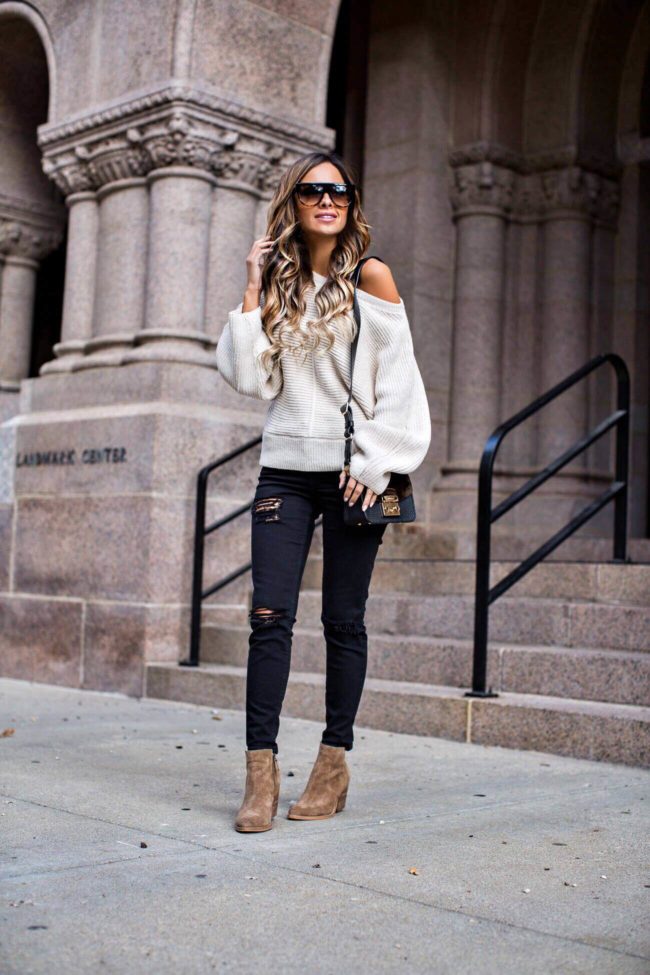 mia mia mine in an off-the-shoulder sweater and black distresses jeans from nordstrom