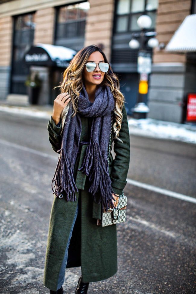 fashion blogger mia mia mine wearing a free people scarf and a gucci dionysus bag