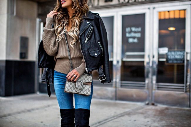 fashion blogger mia mia mine wearing a gucci dionysus bag and a leather jacket