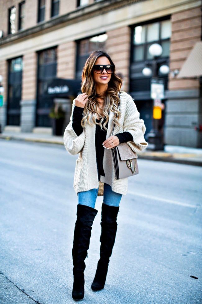 fashion blogger mia mia mine wearing a black bodysuit from nordstrom and celine sunglasses