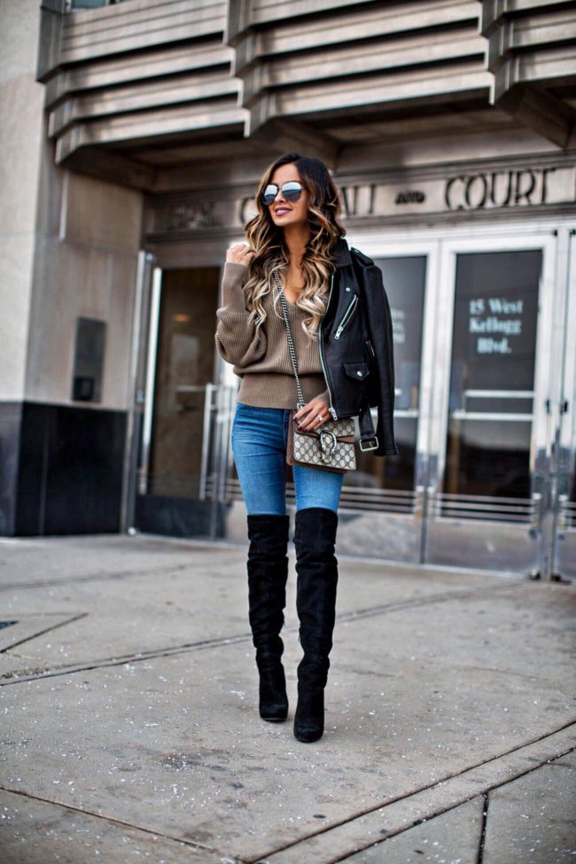 fashion blogger mia mia mine wearing a leather jacket from nordstrom and a free people sweater