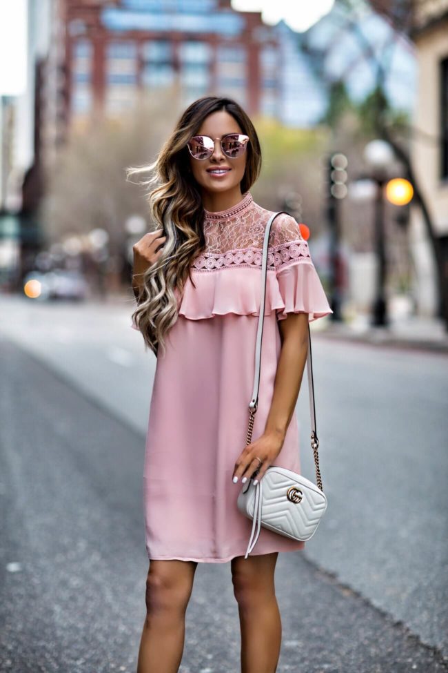 fashion blogger mia mia mine wearing a blush dress from express and a gucci marmont bag for a spring wedding look