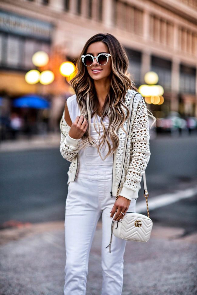 mn fashion blogger mia mia mine wearing a white eyelet bomber jacket by bb dakota and a gucci marmont bag