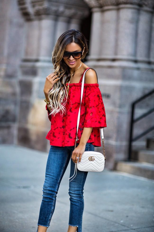 mn fashion blogger mia mia mine wearing a red lace top and a gucci marmont bag