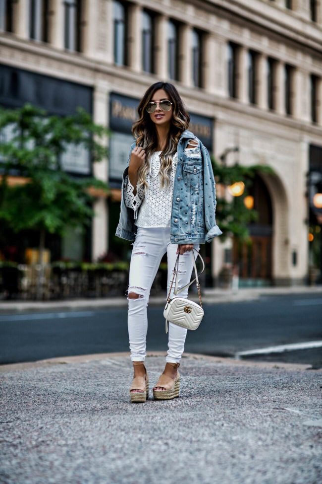 fashion blogger mia mia mine wearing a white eyelet top and white topshop jeans with chloe wedges for spring