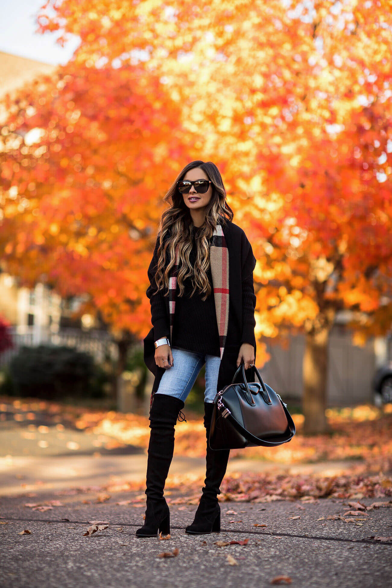 fashion blogger mia mia mine wearing a burberry pocket scarf and stuart weitzman over the knee boots