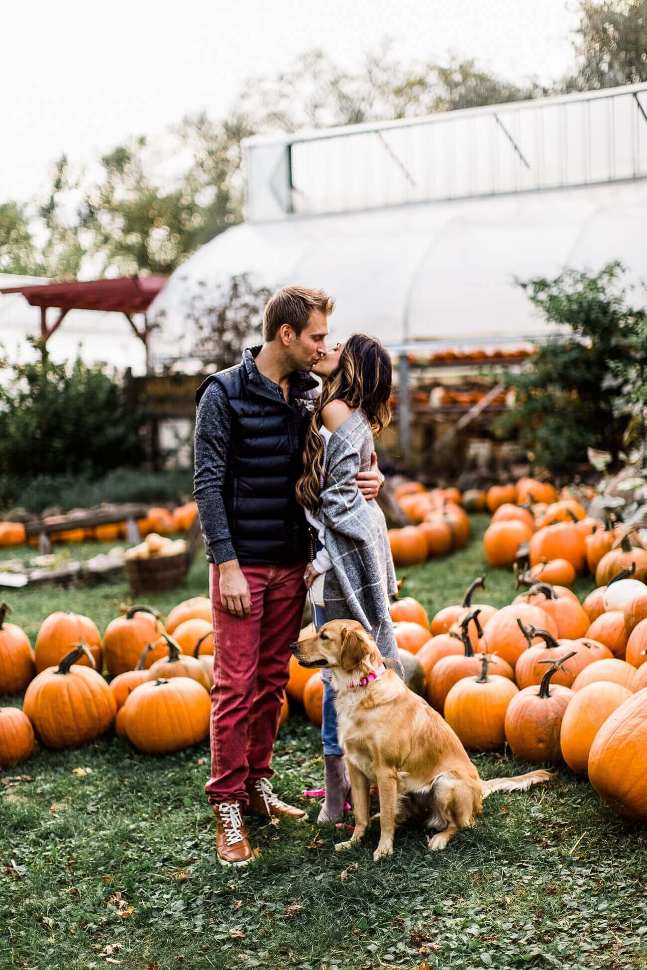 fashion blogger mia mia mine at a pumpkin patch her husband