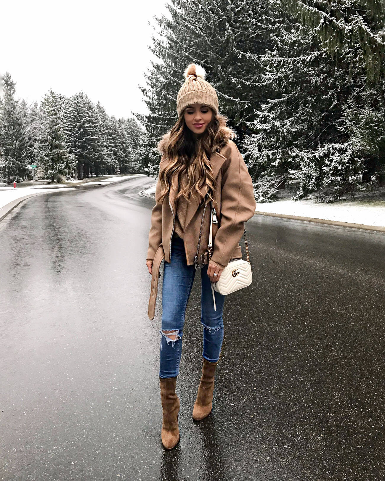 mia mia mine wearing a camel coat and beanie from H&M