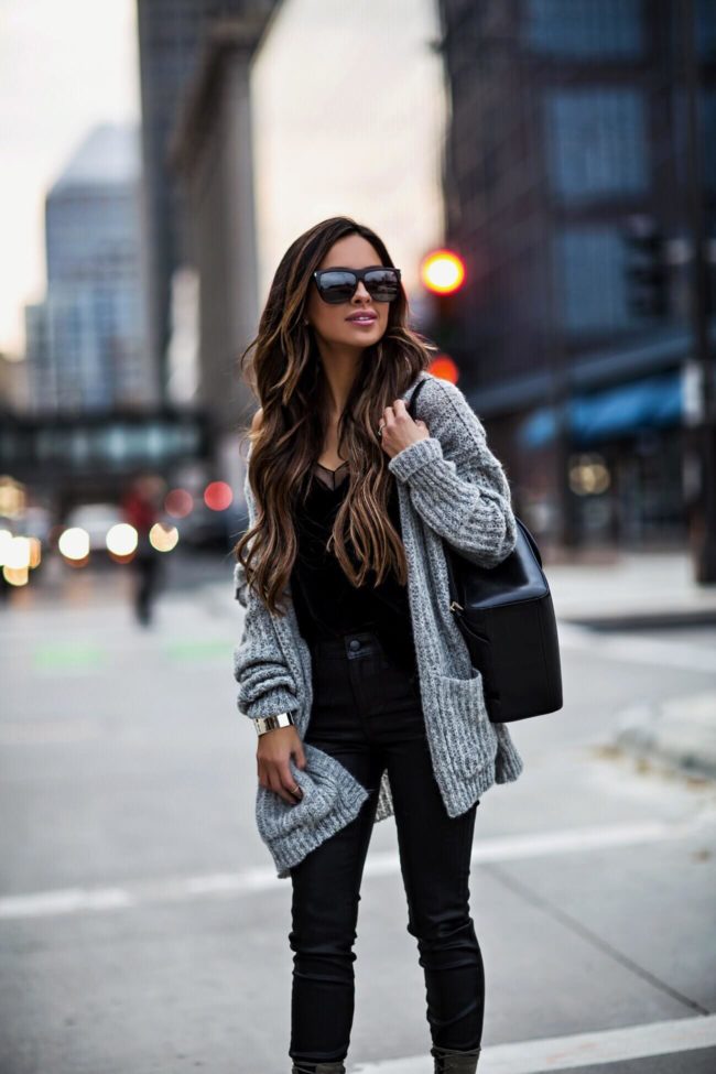 mia mia mine wearing a free people cardigan and a black velvet cami