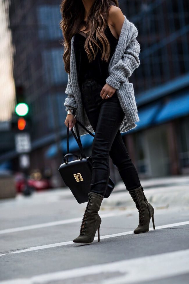 mia mia mine wearing lace-up steve madden booties and a gray free people cardigan