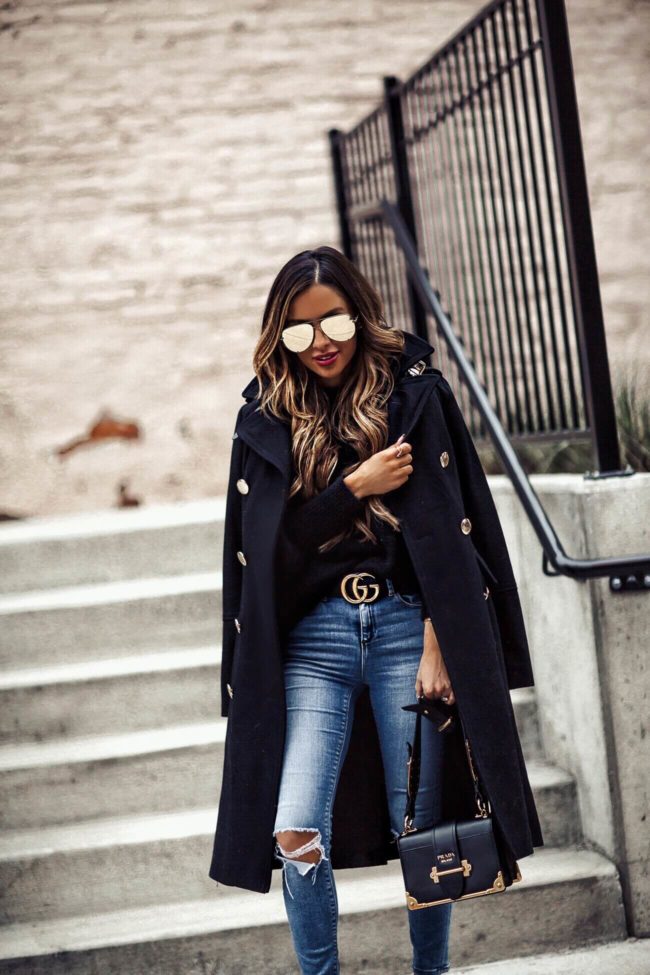 fashion blogger mia mia mine wearing a black double-breasted coat from macy's
