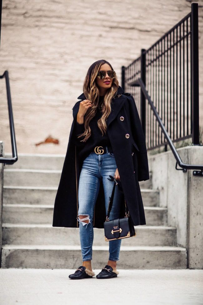 fashion blogger mia mia mine wearing steve madden faux fur slides and a prada cahier bag