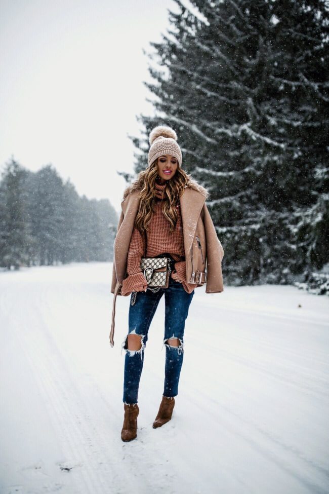 fashion blogger mia mia mine wearing a camel coat from H&M and a gucci dionysus bag