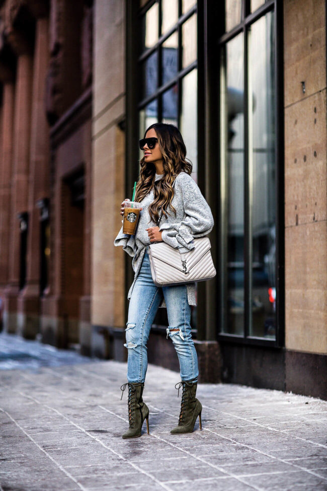 mia mia mine wearing levi's denim and a saint laurent college bag