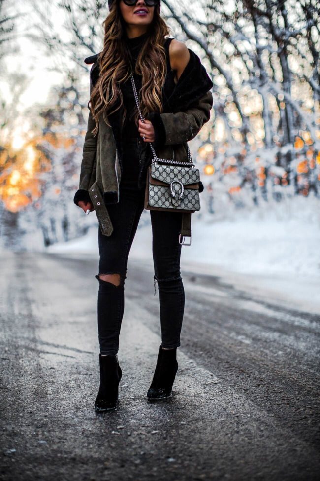 mia mia mine wearing a gucci dionysus bag and asos black denim