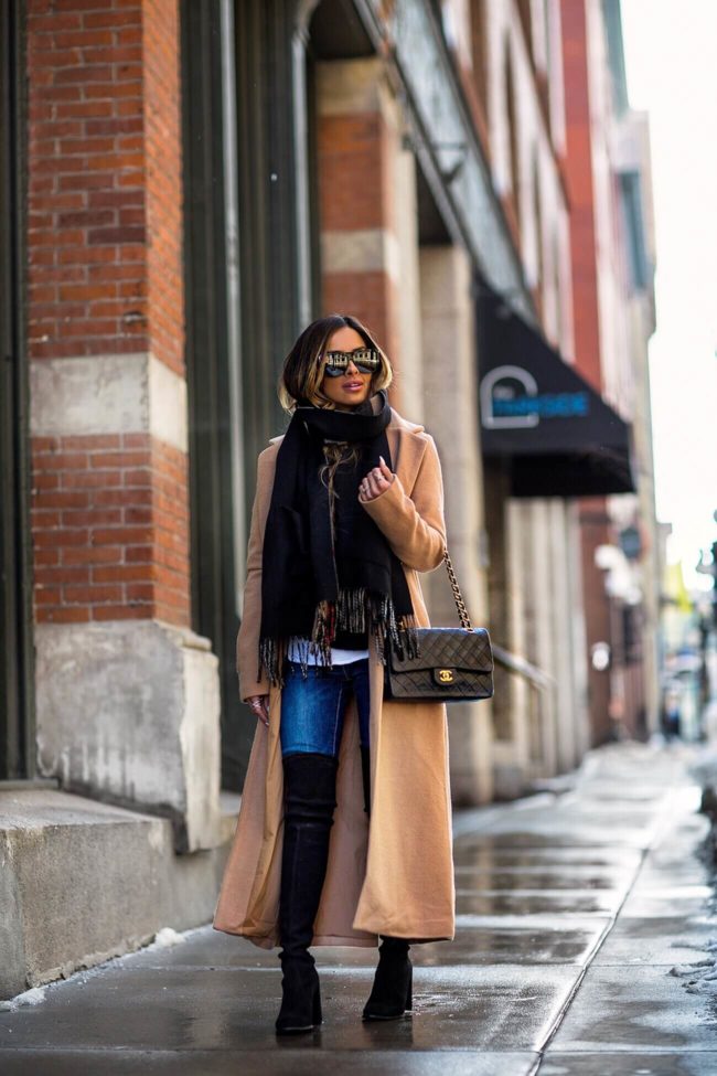 fashion blogger mia mia mine wearing a camel coat from revolve and a chanel bag and camel coat from revovle