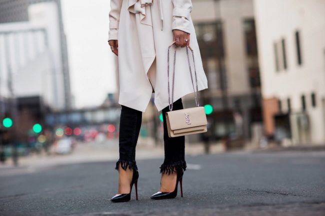fashion blogger mia mia mine wearing a saint laurent sunset bag and free people fringe denim