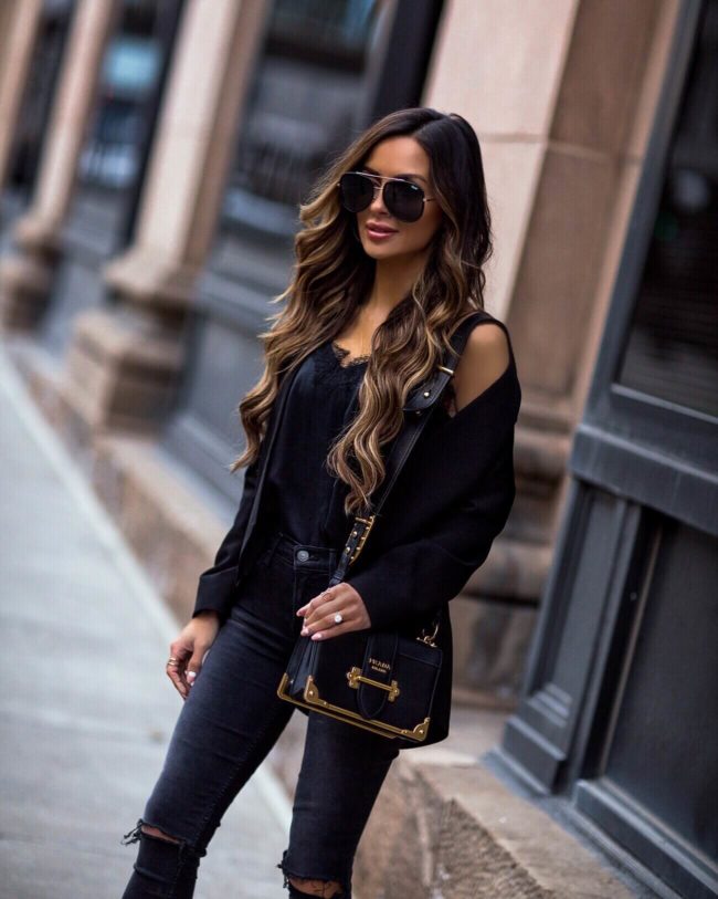 fashion blogger mia mia mine wearing a black blazer from revolve and a prada cahier bag