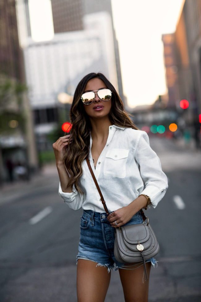 fashion blogger mia mia mine wearing a white tommy hilfiger linen shirt