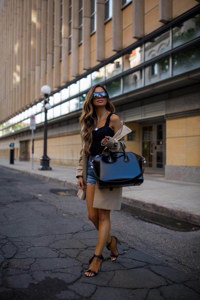 fashion blogger mia mia mine wearing a burberry trenchcoat and a black free people bodysuit from shopbop