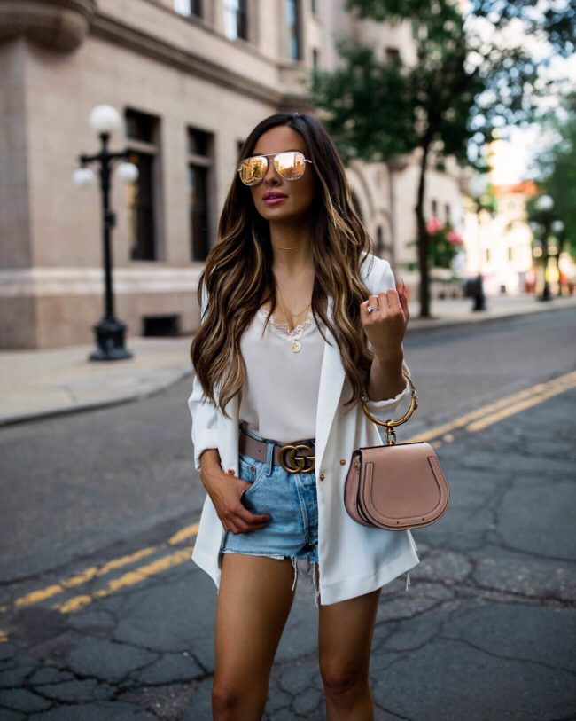 fashion blogger mia mia mine wearing a white blazer and a pink chloe nile bag and pink gucci belt