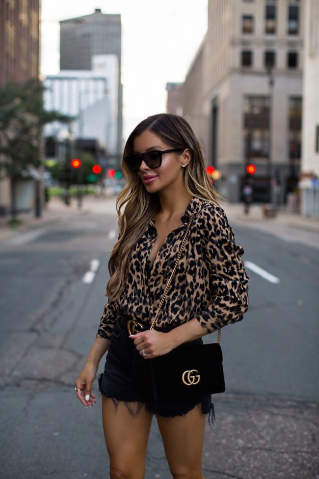 fashion blogger mia mia mine wearing nordstrom leopard shirt with black gucci belt and gucci velvet handbag