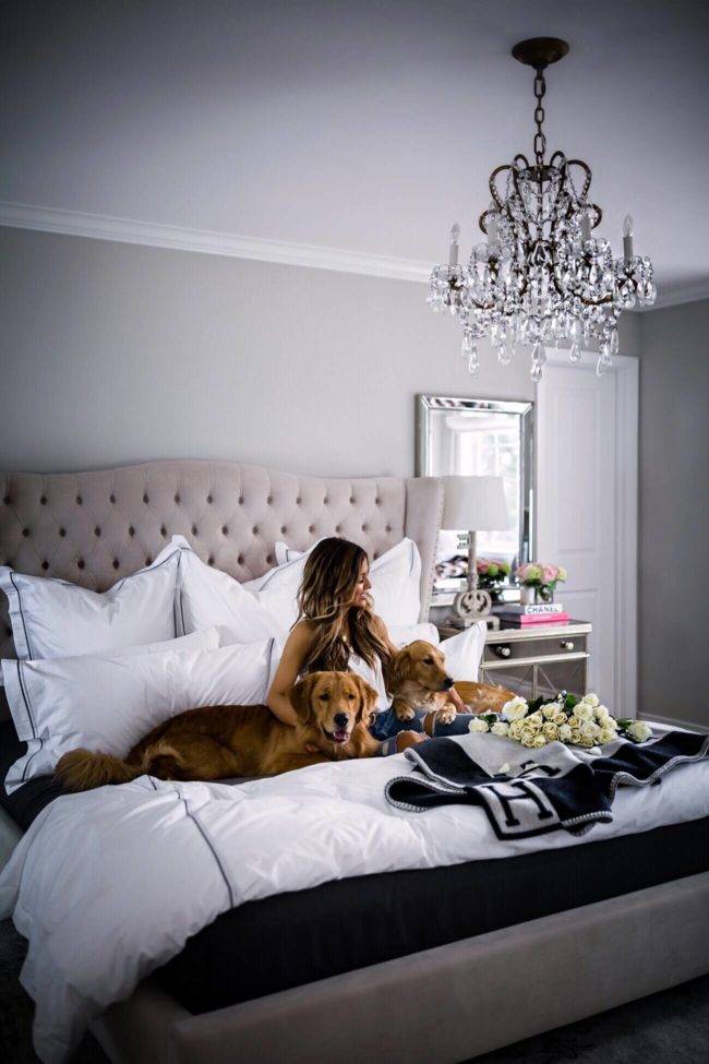 mia mia mine in her master bedroom with bloomingdale's hotel bedding