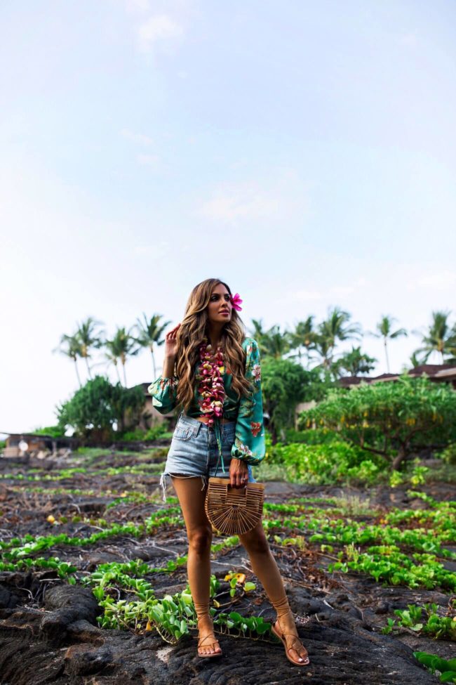 fashion blogger mia mia mine wearing a cult gaia handbag at the four seasons hualalai