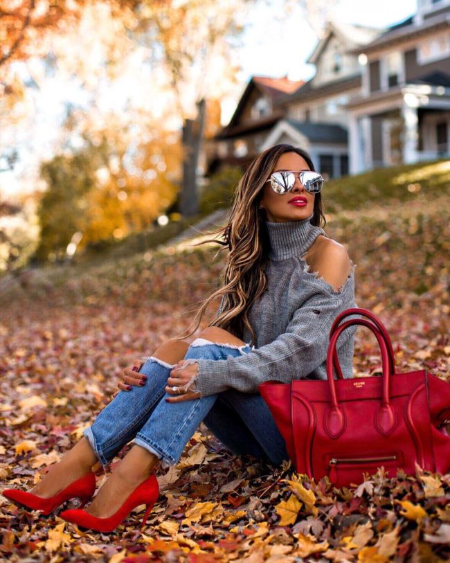 fashion blogger mia mia mine wearing a gray sweater and a red celine bag