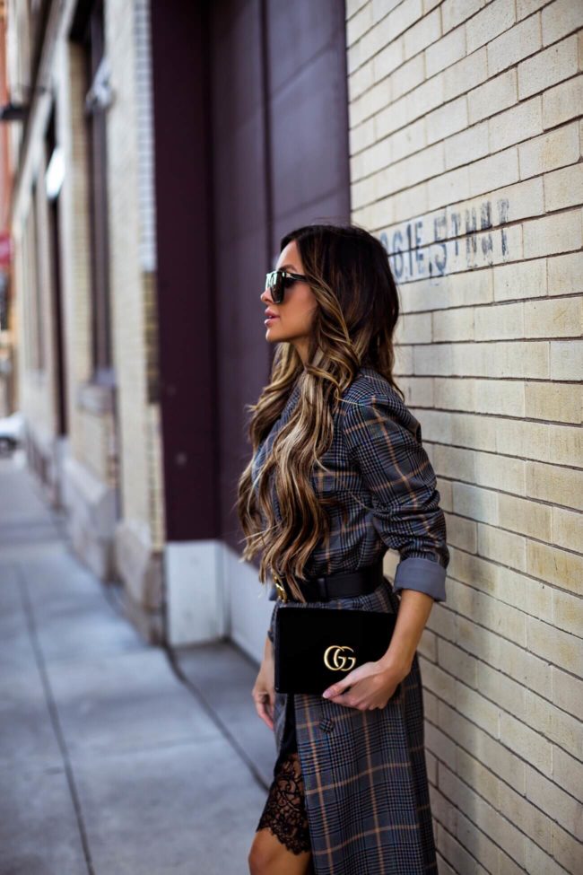 fashion blogger mia mia mine wearing a plaid coat from revolve and a gucci marmont bag