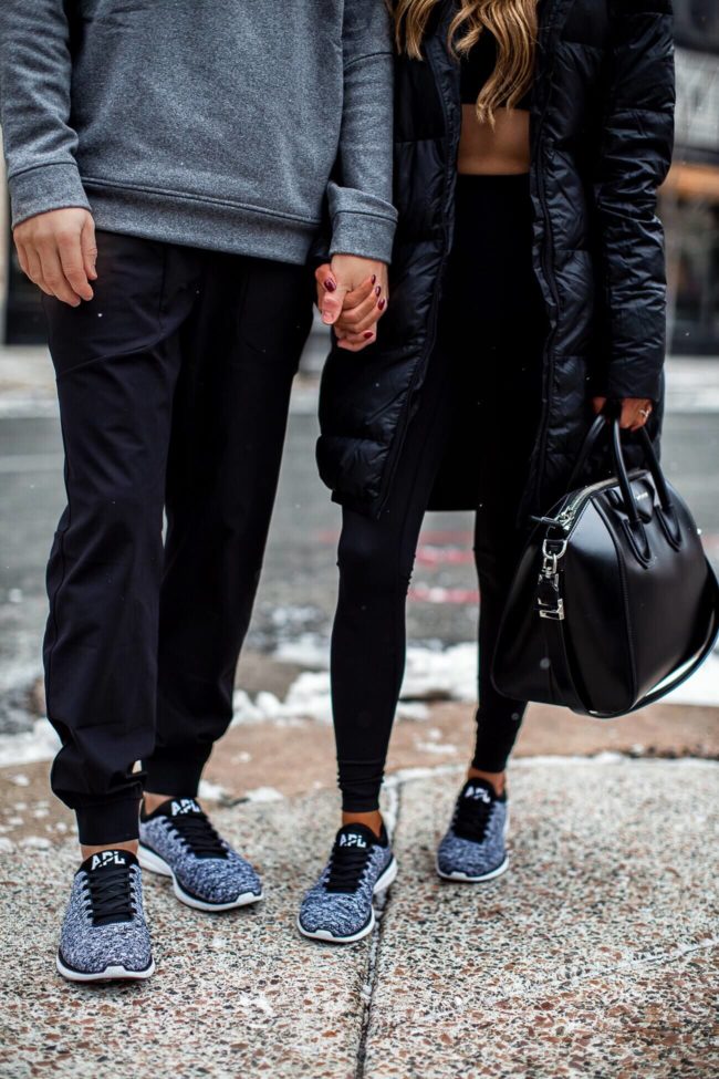 fashion blogger mia mia mine wearing a lululemon outfit with apl sneakers