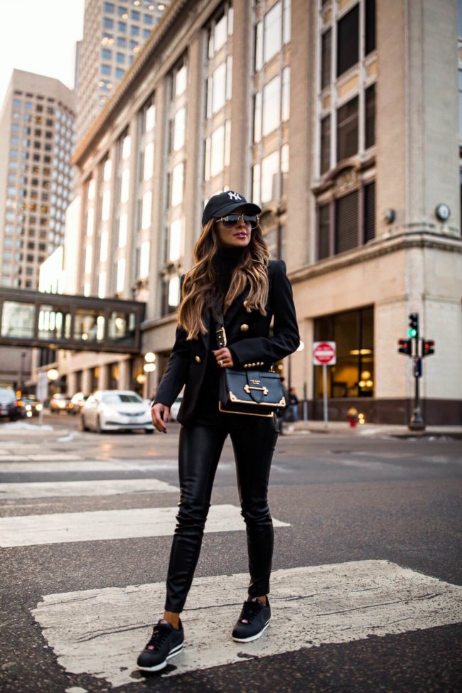 fashion blogger mia mia mine wearing prada cahier bag and a ny yankees hat