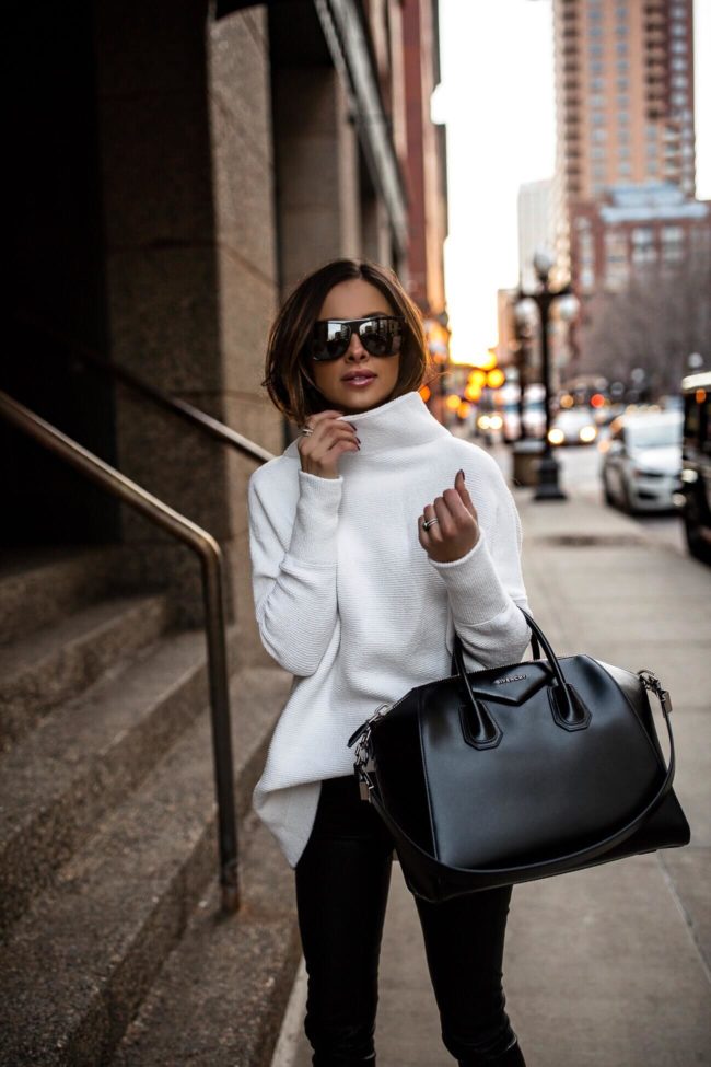 fashion blogger mia mia mine wearing a white free people sweater and a givenchy antigona sweater