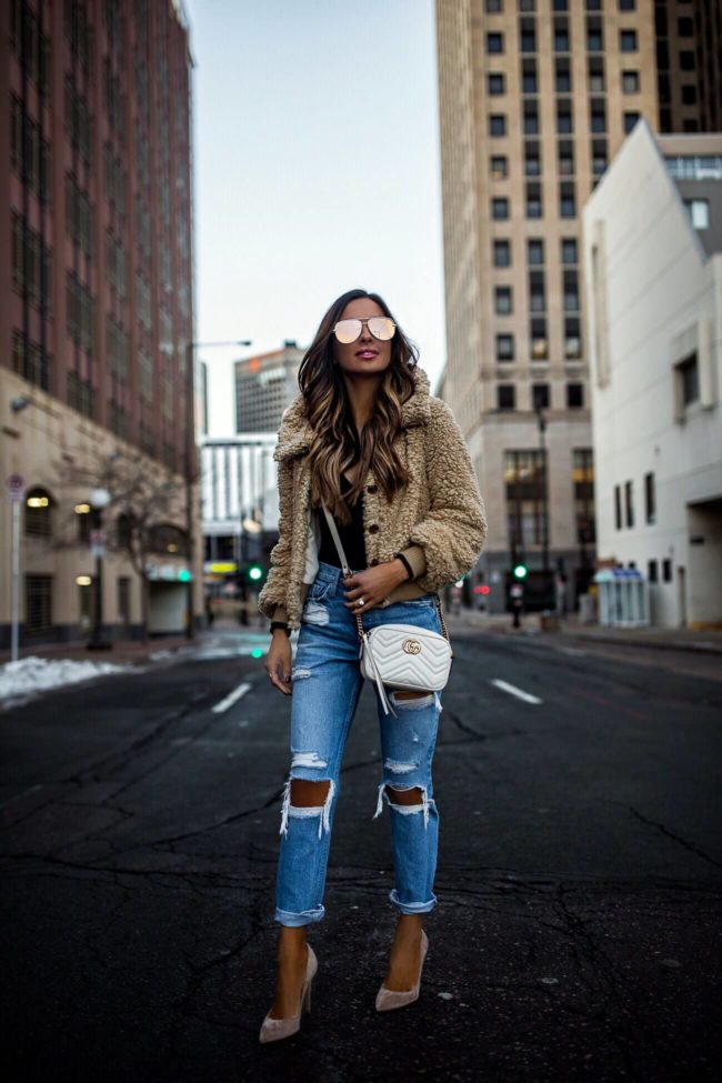 fashion blogger mia mia mine wearing a white gucci marmont mini bag and gianvito rossi heels