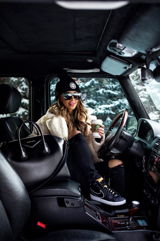 fashion blogger mia mia mine wearing nike sneakers with a givenchy antigona bag