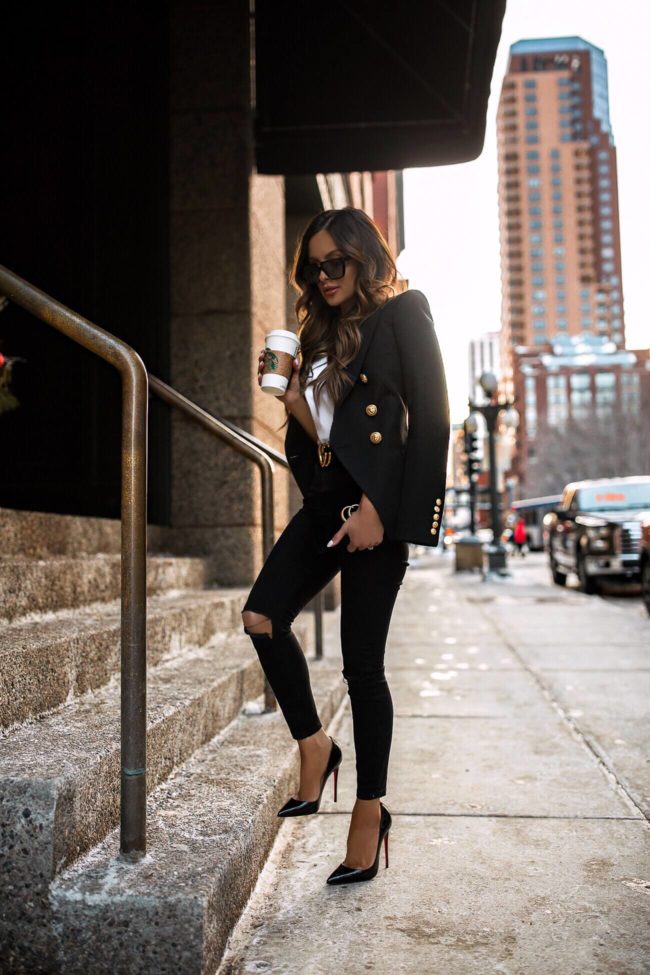 fashion blogger mia mia mine wearing a gucci belt and a balmain blazer