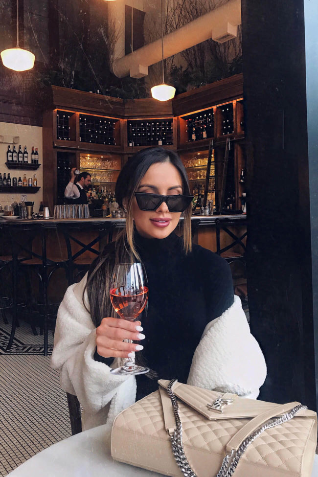 fashion blogger mia mia mine wearing a commando bodysuit and an H&M teddy bear coat spring 2019