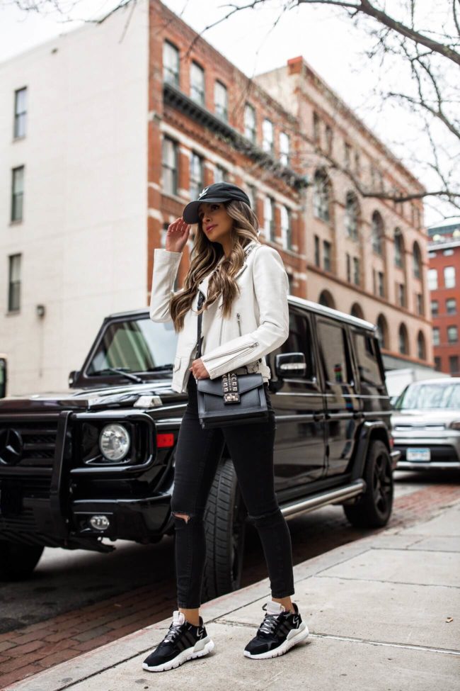 fashion blogger mia mia mine wearing a valentino bag and adidas nite jogger sneakers