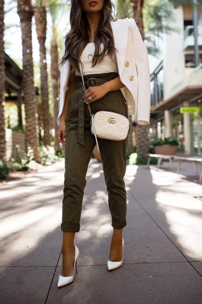 fashion blogger mia mia mine wearing christian louboutin white heels and a gucci marmont mini white bag